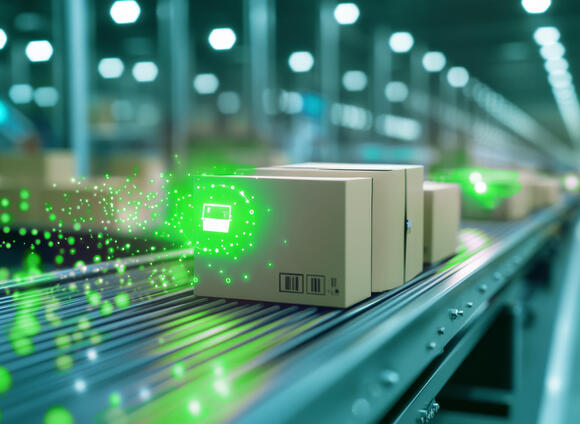 Packages on a conveyor belt in a warehouse.