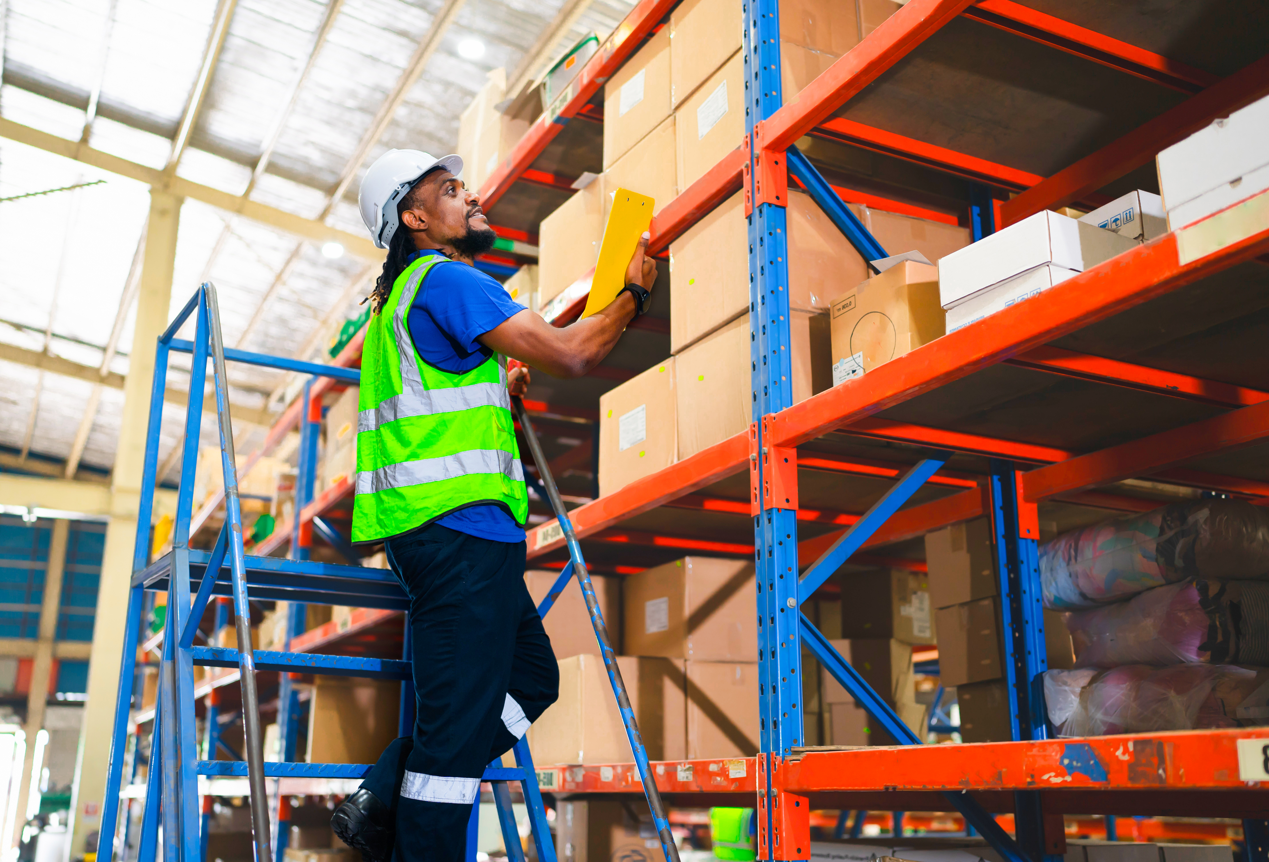 Man working in a warehouse Man working in a warehouse